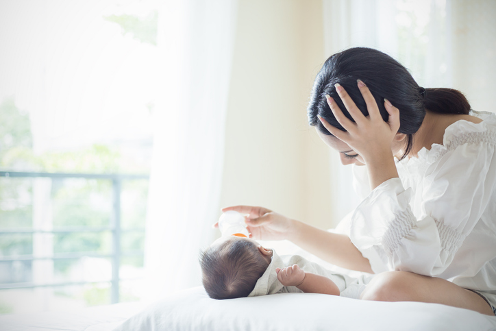 mother bottle feeding baby due to post natal depression
